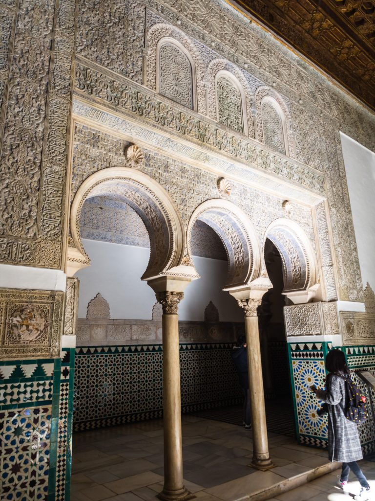 Three ornate horseshoe arches in the Royal Bedroom in the Alcazar of Seville